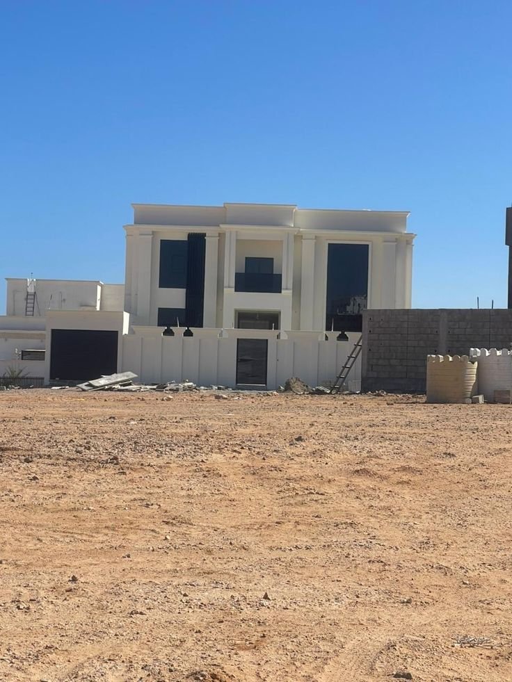 ترميم واجهة منزل وتحسين المظهر الخارجي للمبنى.
